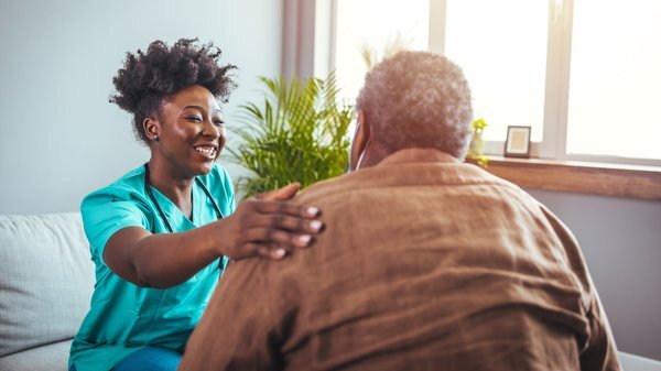 assisted-living-healthcare-worker-assisting-elderly-patient